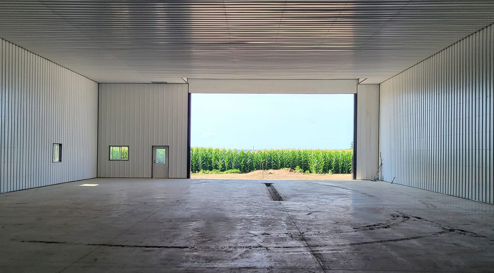 Spacious clear-span post-frame farm building interior